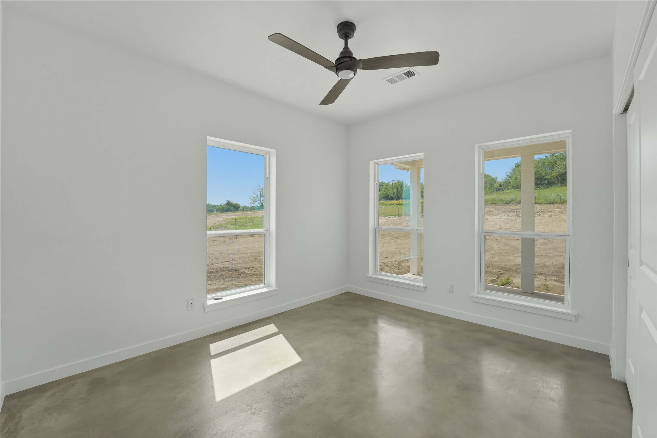 9345 Hajovsky Road La Grange, TX 78945 - Photo 9 of 24 a view of an empty room with a window