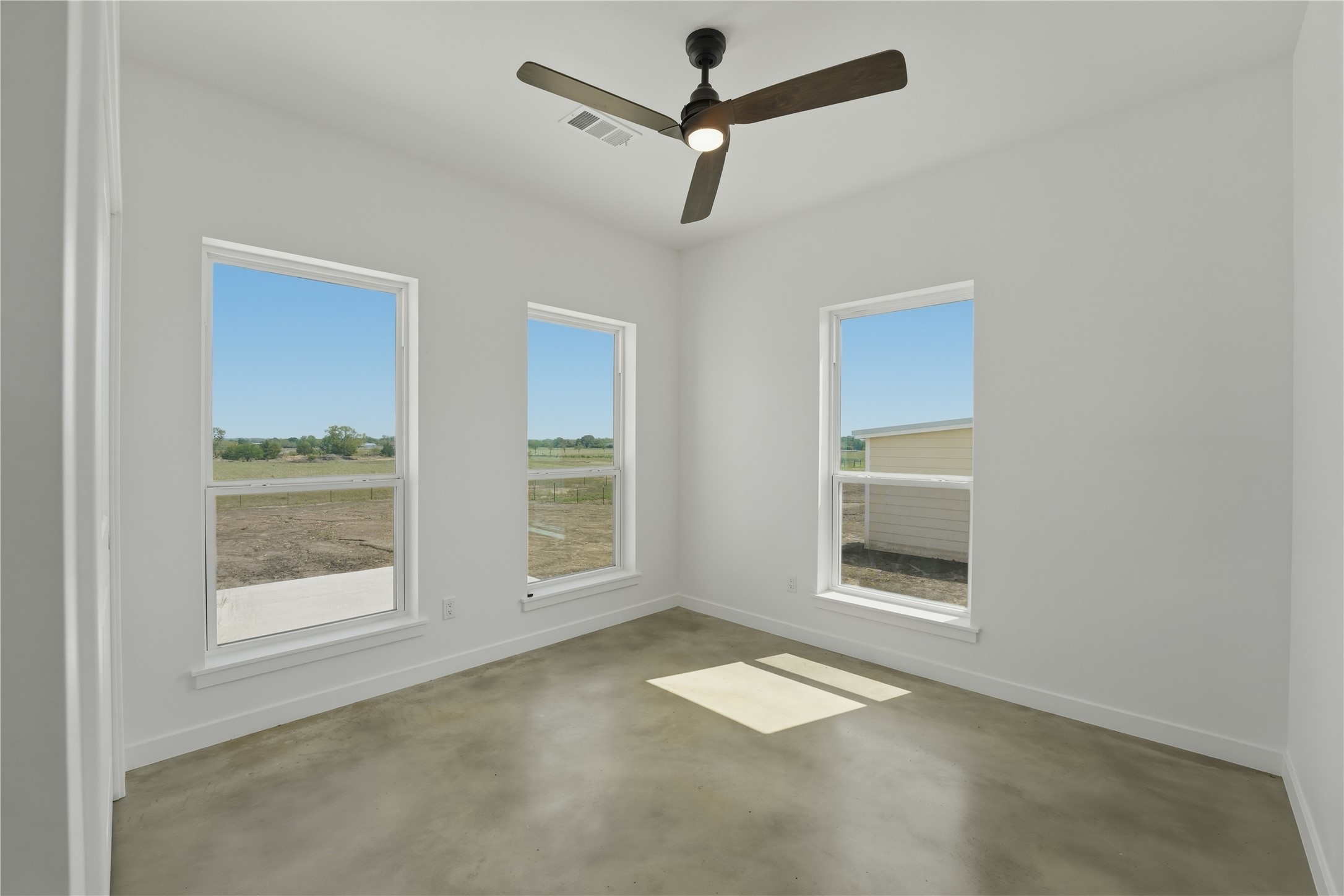 9345 Hajovsky Road La Grange, TX 78945 - Photo 10 of 24 a view of empty room with front door