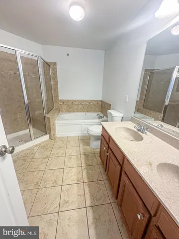 a bathroom with a sink a mirror and a bathtub