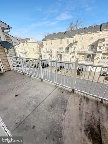 a white toilet sitting next to a bath tub
