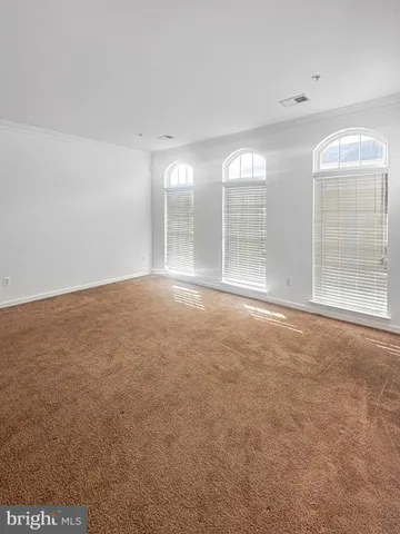 an empty room with windows and view