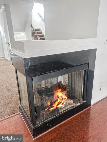 a view of fireplace and wooden floor