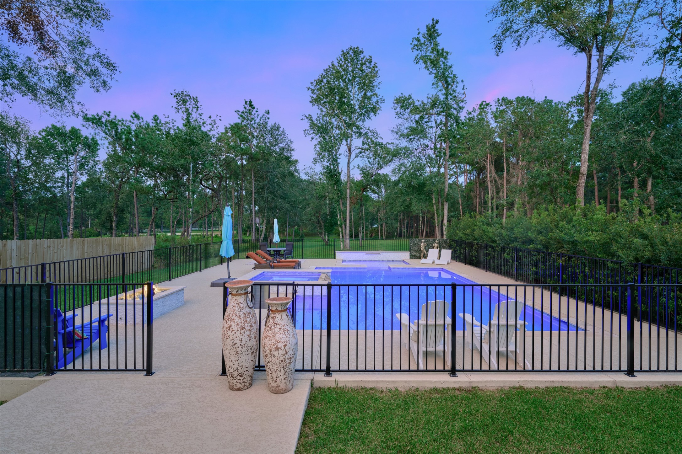 2218 Honea Egypt Road Magnolia, TX 77354 - Photo 21 of 50 Unwind in your private poolside oasis, enveloped by serene nature.