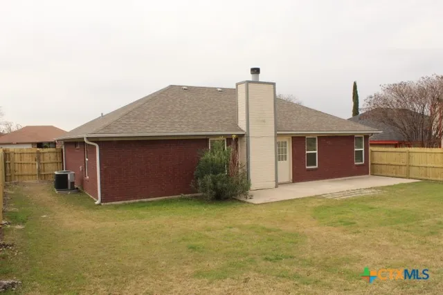 a view of an house with backyard space