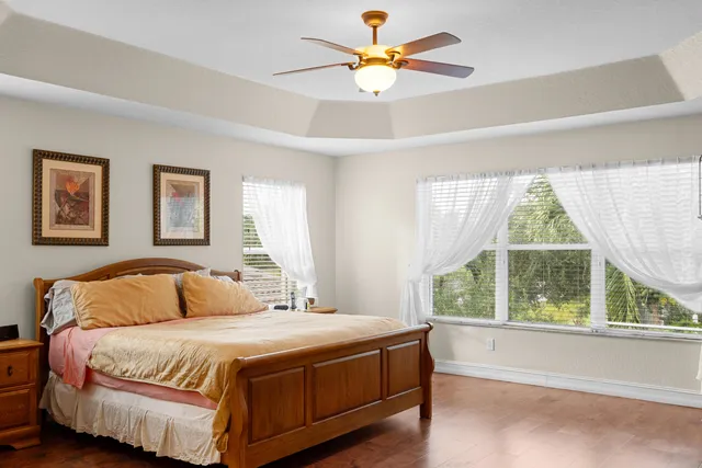 a bedroom with a large bed and a window