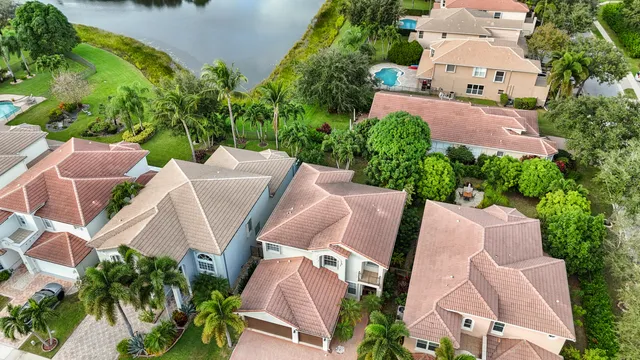 an aerial view of a house with outdoor space and street view