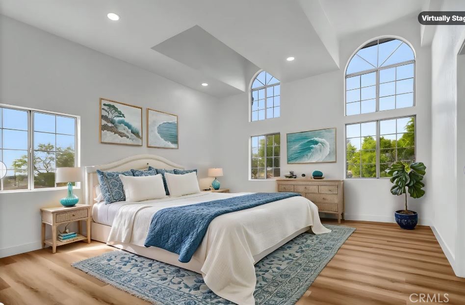 1200 South Castlegate Avenue Compton, CA 90221 - Photo 27 of 39 a bedroom with a large bed and a large window
