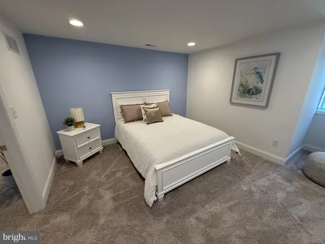 a bedroom with a bed and a cabinets