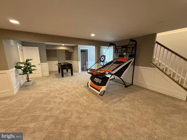 a living room with furniture pool and a table