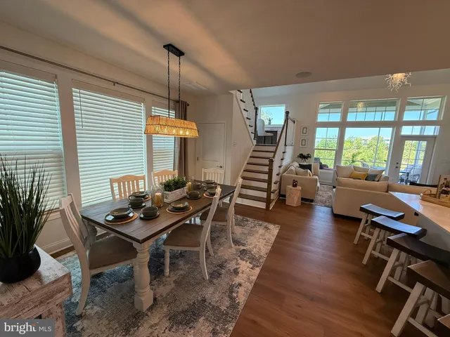 a livingroom with furniture and a potted plant