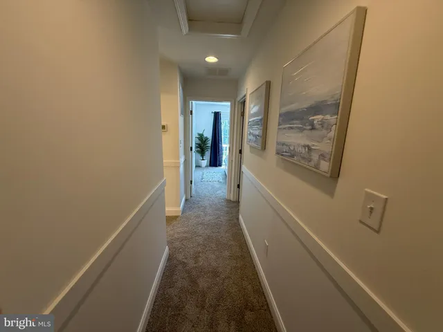 a hallway with a wooden floor