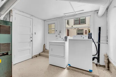 a bathroom with a bathtub and a toilet