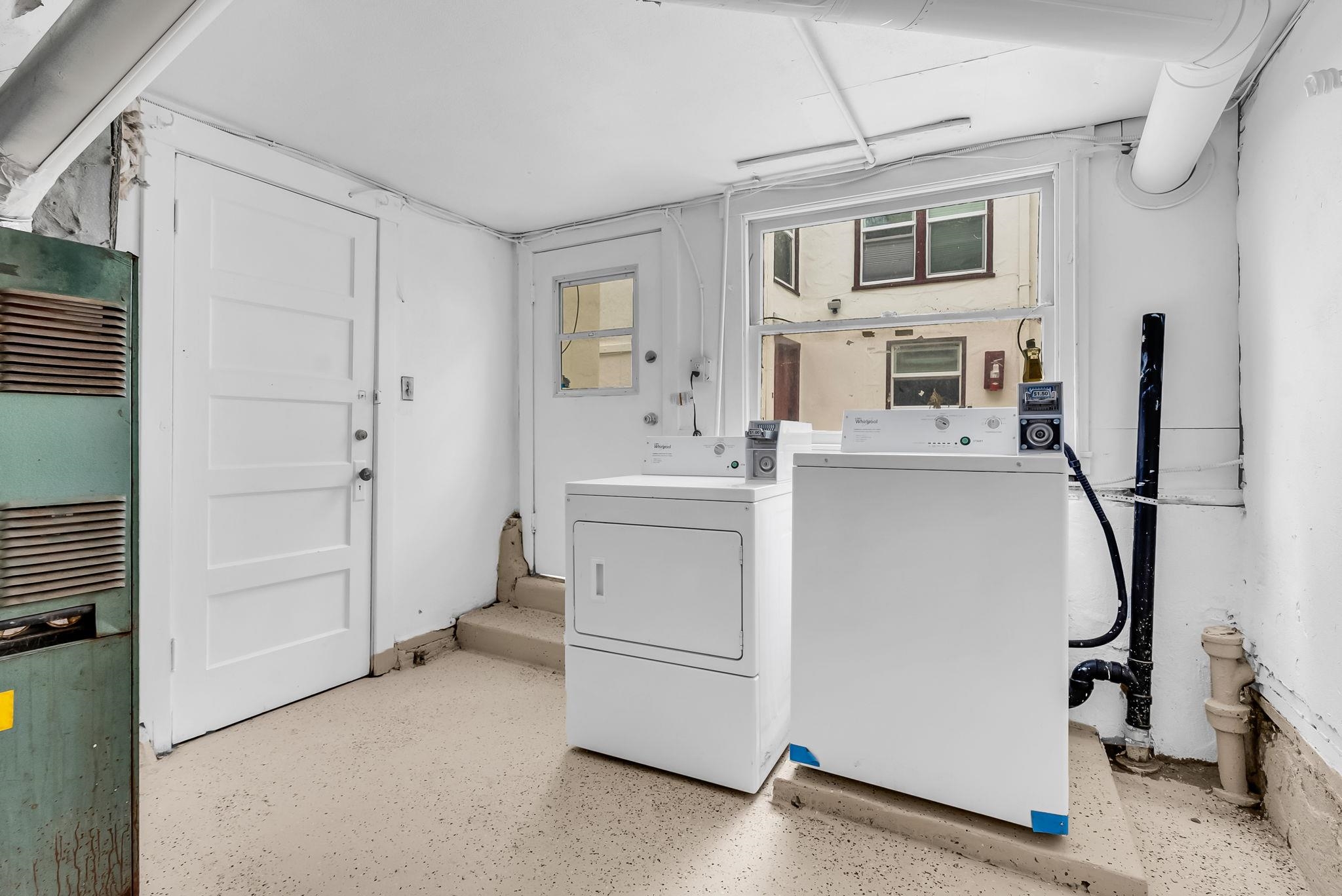 2340 Virginia Street Berkeley, CA 94709 - Photo 26 of 60 a utility room with cabinets washer and dryer