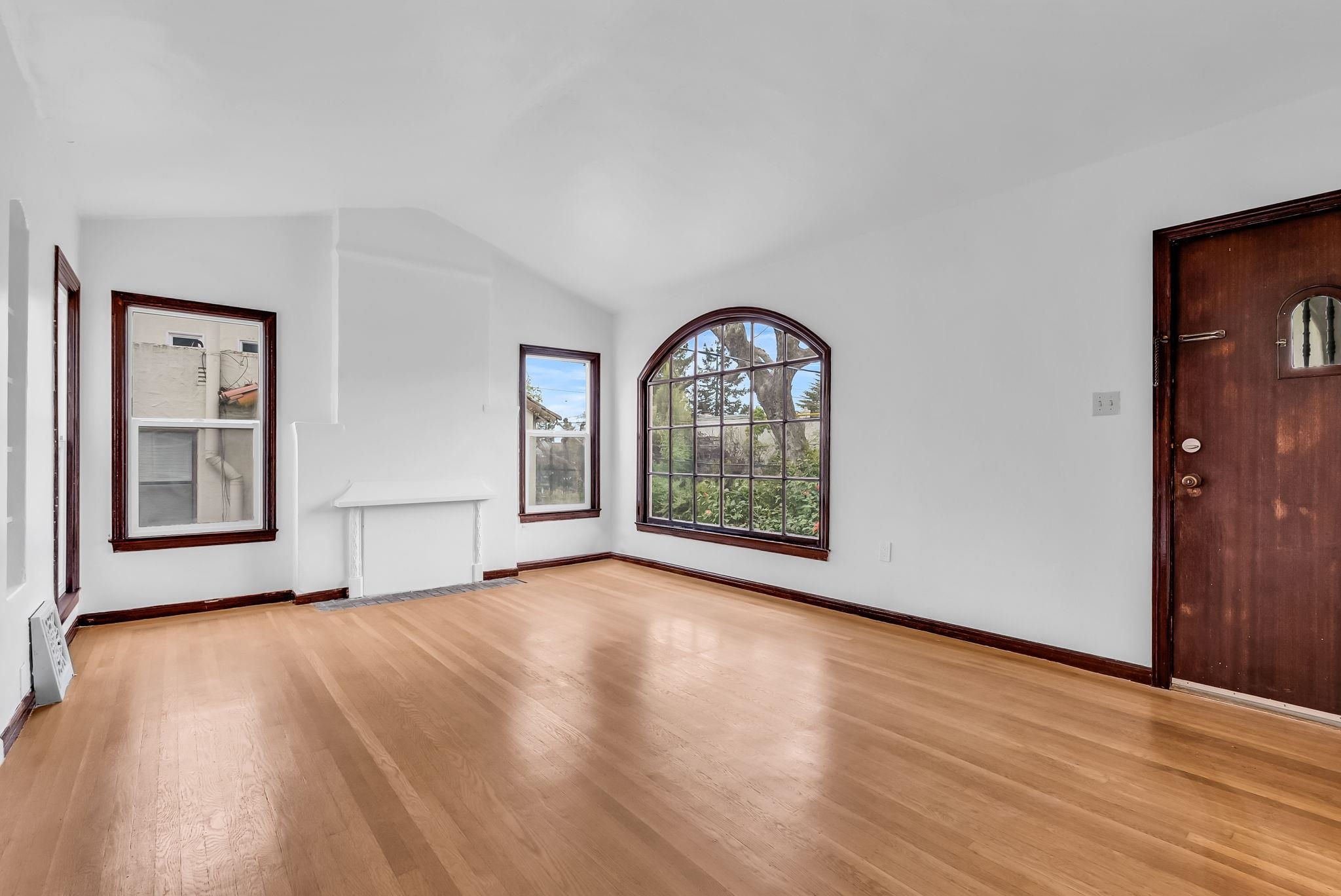 2340 Virginia Street Berkeley, CA 94709 - Photo 6 of 60 a view of an empty room with glass door and wooden floor