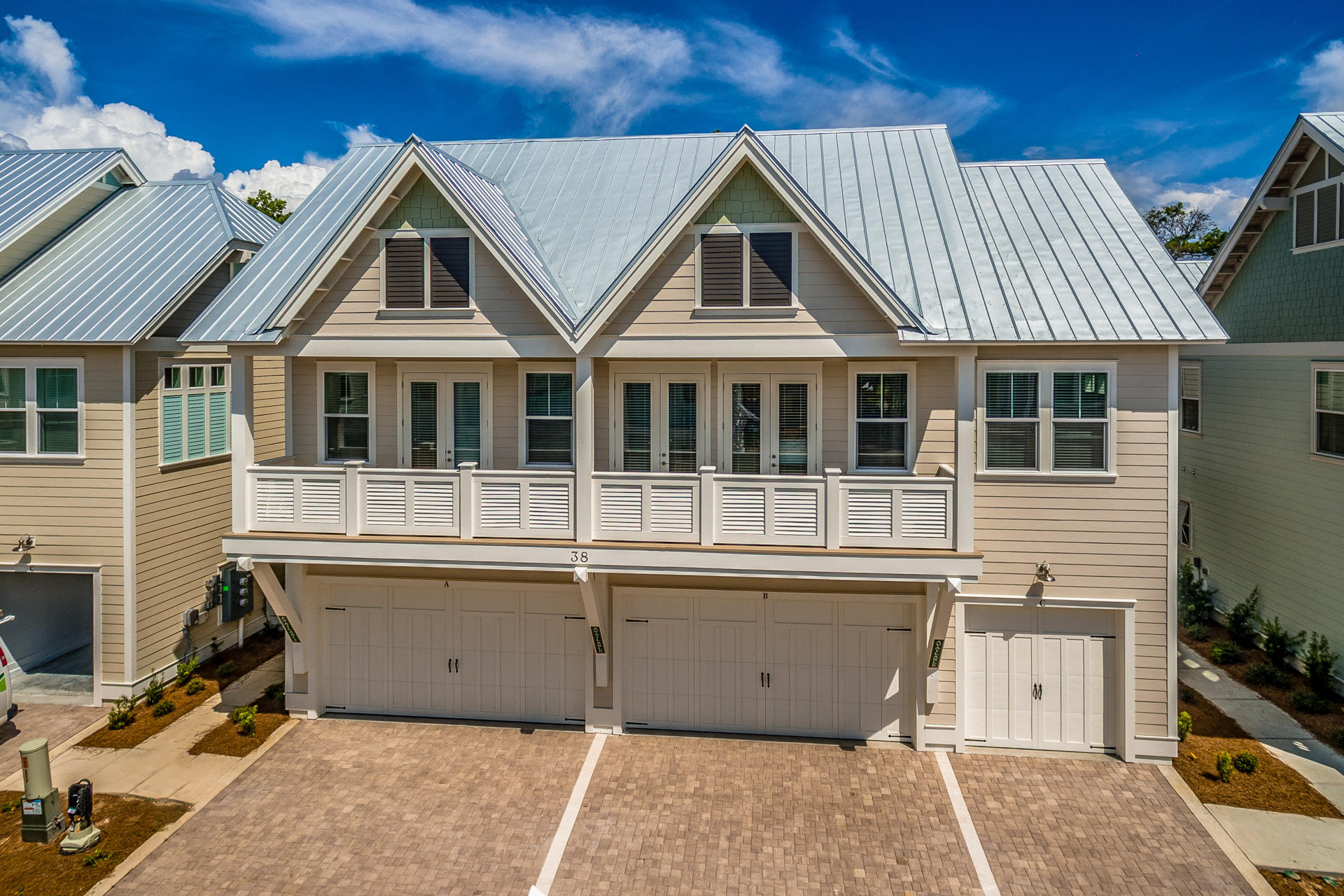 38 Pine Lands Loop East, Unit 447B Inlet Beach, FL 32461 - Photo 1 of 32 a front view of a house with a garage