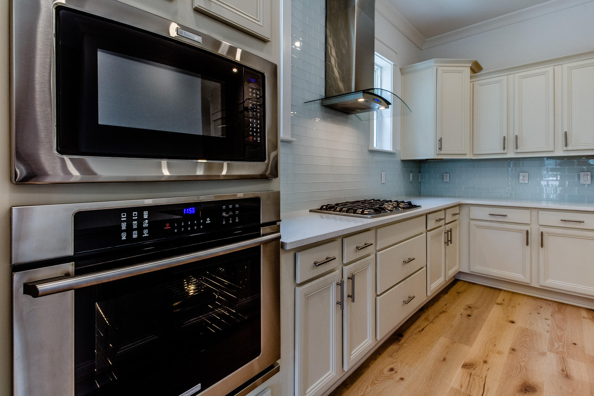 38 Pine Lands Loop East, Unit 447B Inlet Beach, FL 32461 - Photo 5 of 32 a kitchen with stainless steel appliances a stove and a microwave