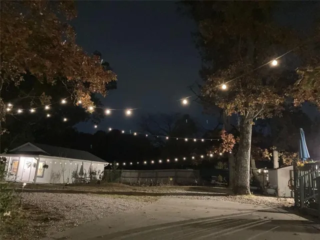 a very nice looking living room with a large window and furniture