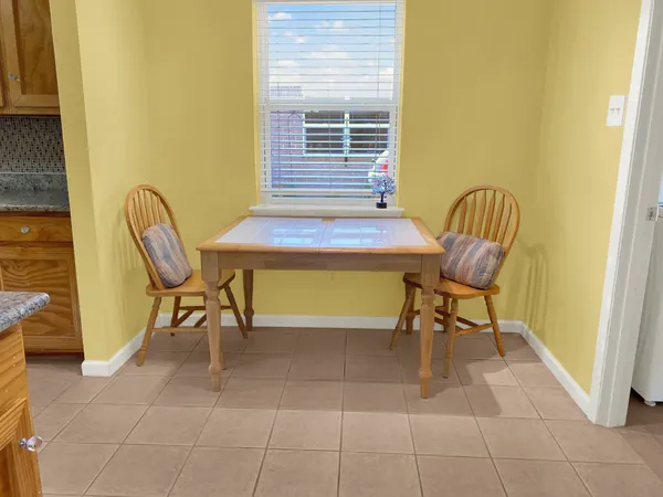 a view of a lobby with chair and table