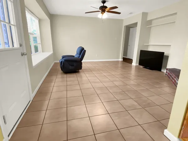 a living room with a black white checkered floor