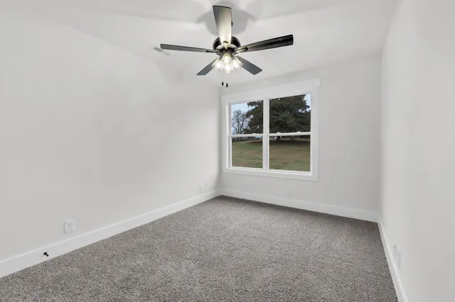 a front view of a house with yard