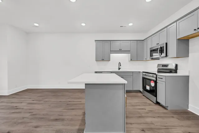 a kitchen with a sink and cabinets