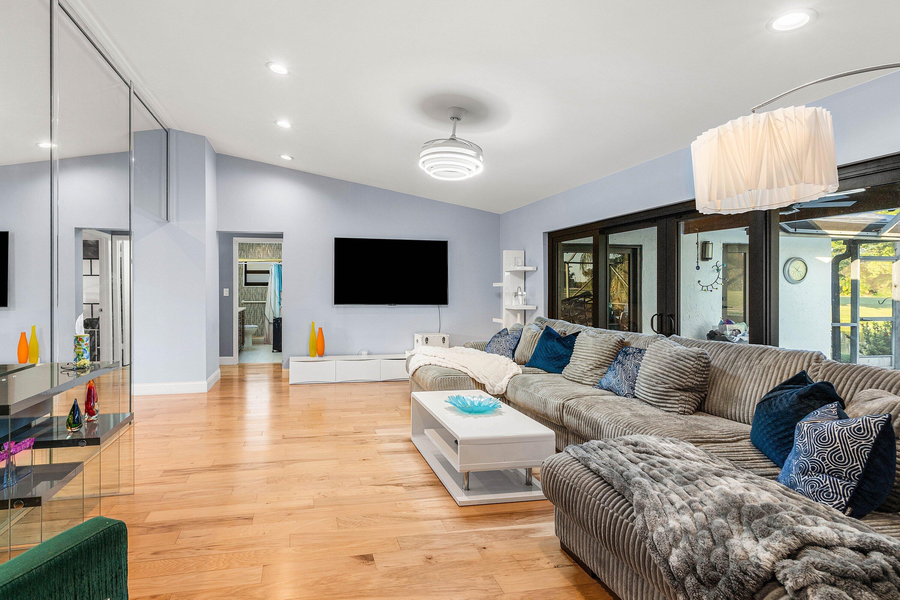 10174 Crosswind Road Boca Raton, FL 33498 - Photo 13 of 45 a living room with furniture and a flat screen tv