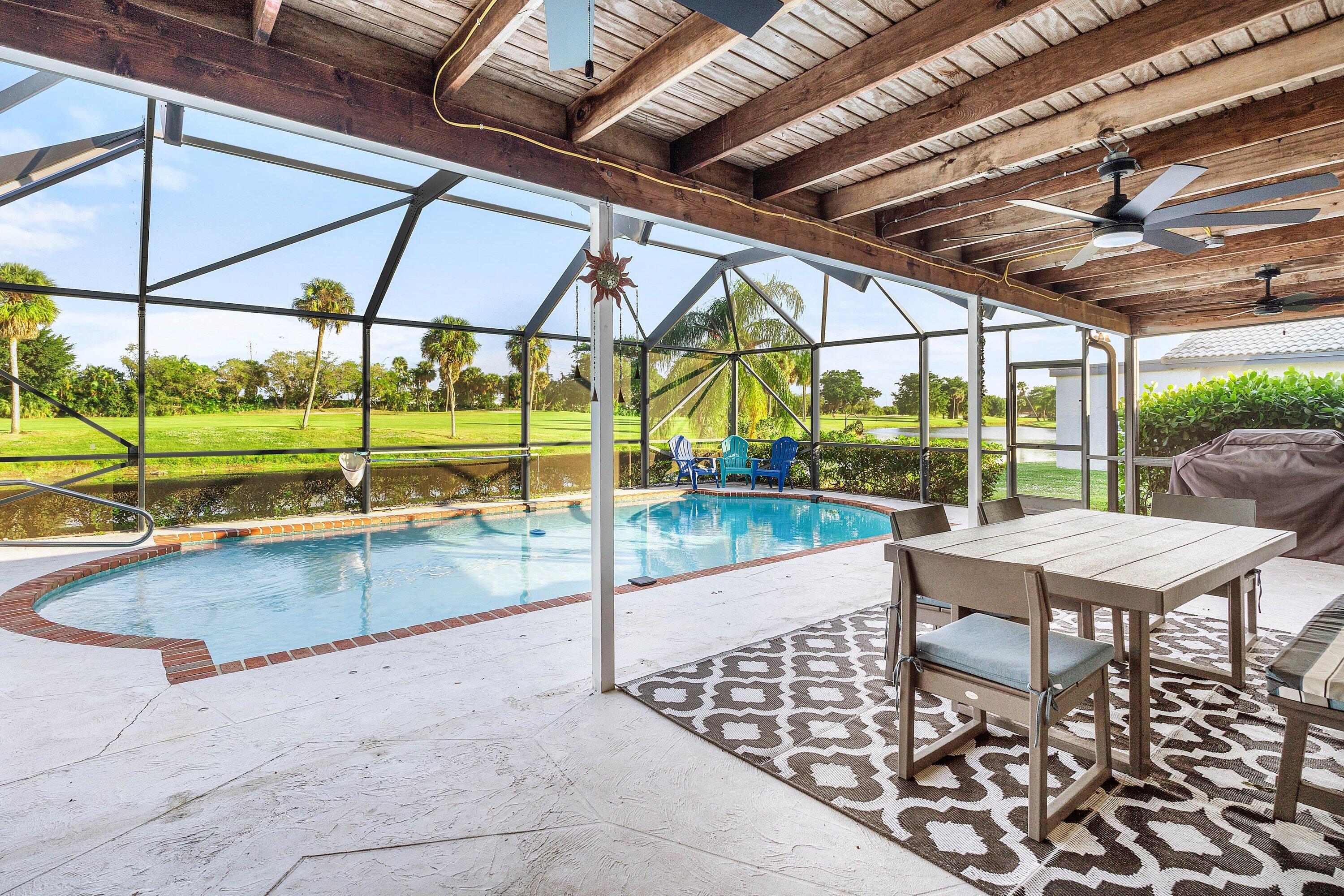 10174 Crosswind Road Boca Raton, FL 33498 - Photo 24 of 45 a view of swimming pool with outdoor seating