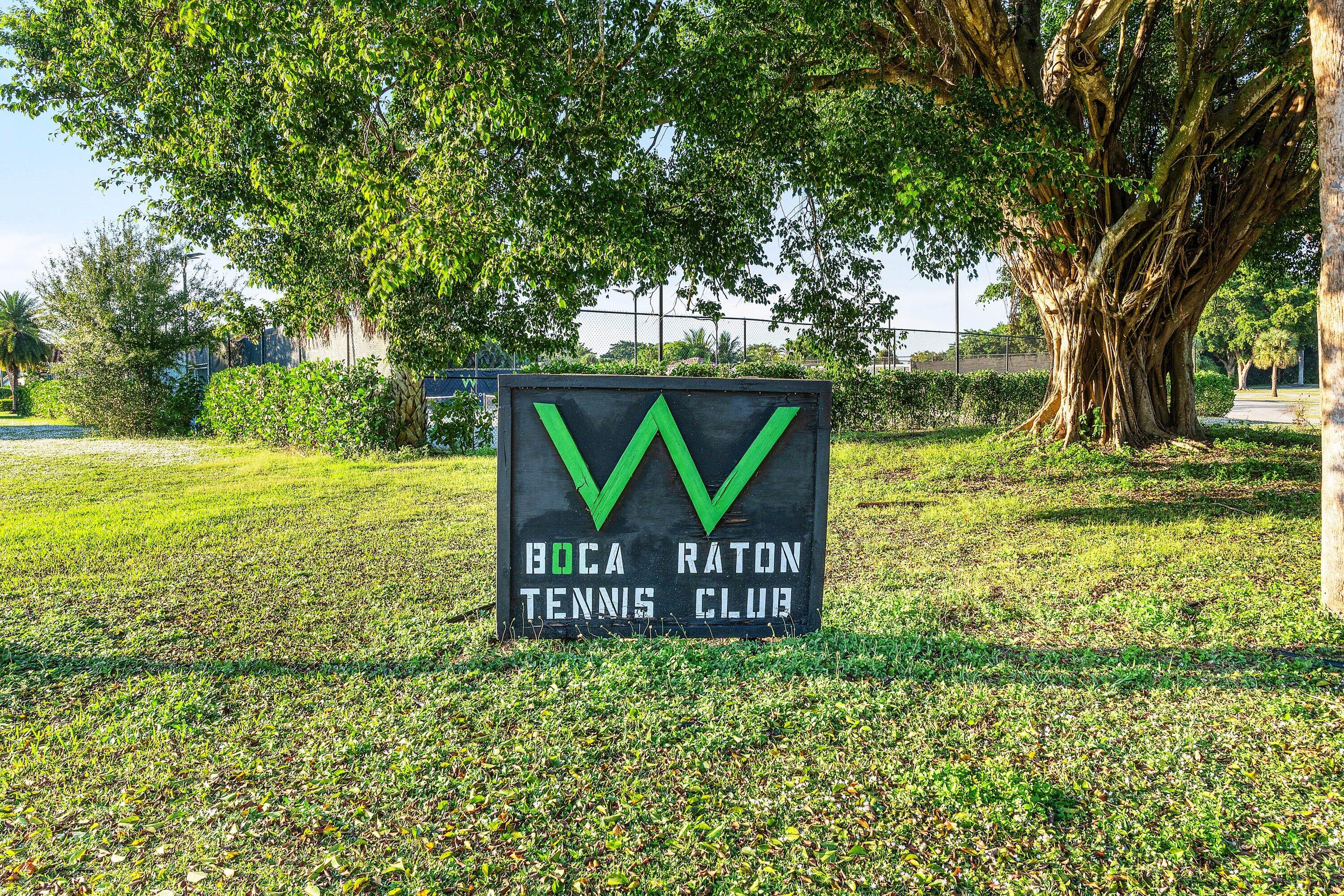 10174 Crosswind Road Boca Raton, FL 33498 - Photo 29 of 45 a view of a park that has a sign board large trees