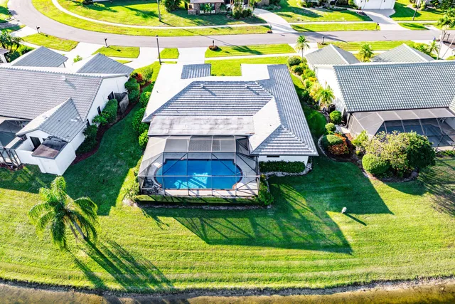 a aerial view of a house with a yard