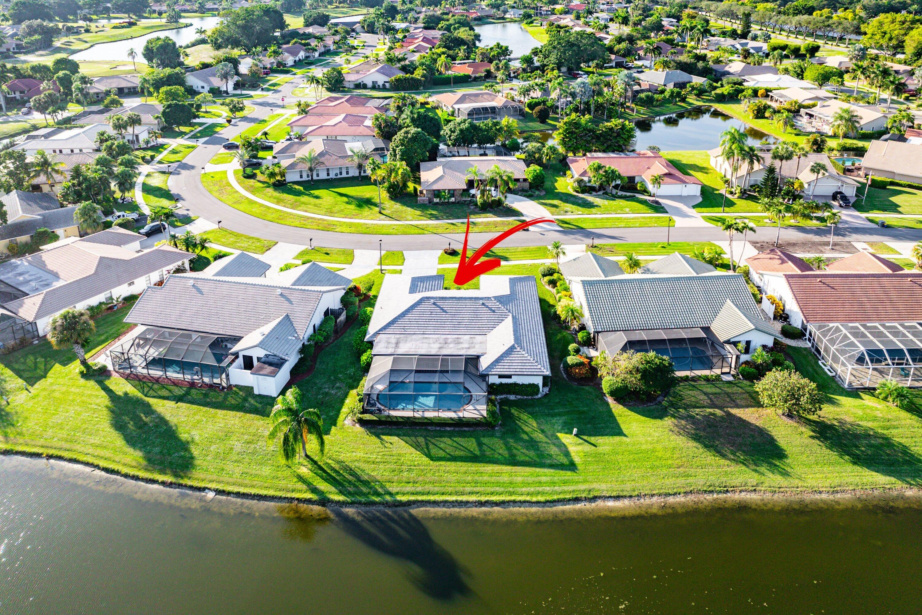 10174 Crosswind Road Boca Raton, FL 33498 - Photo 39 of 45 a view of houses with swimming pool and outdoor space