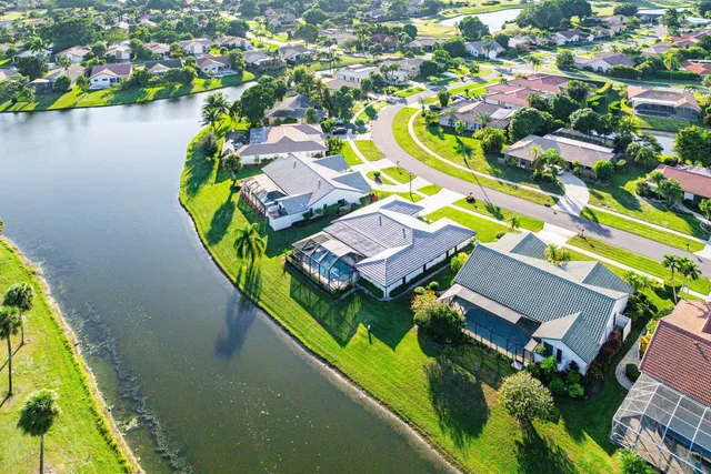 an aerial view of a house with a swimming pool yard and outdoor seating