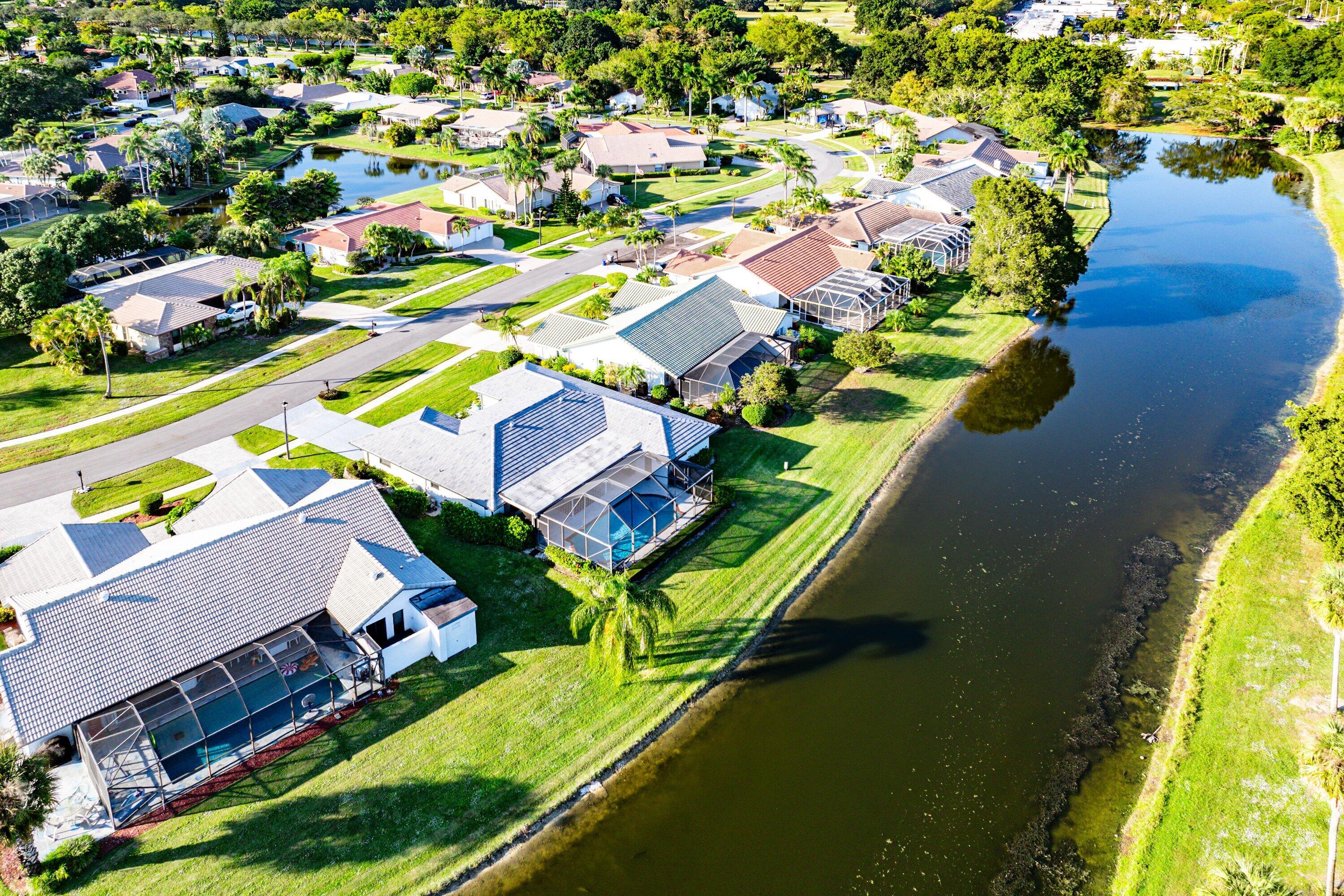 10174 Crosswind Road Boca Raton, FL 33498 - Photo 44 of 45 an aerial view of a house with a garden and swimming pool