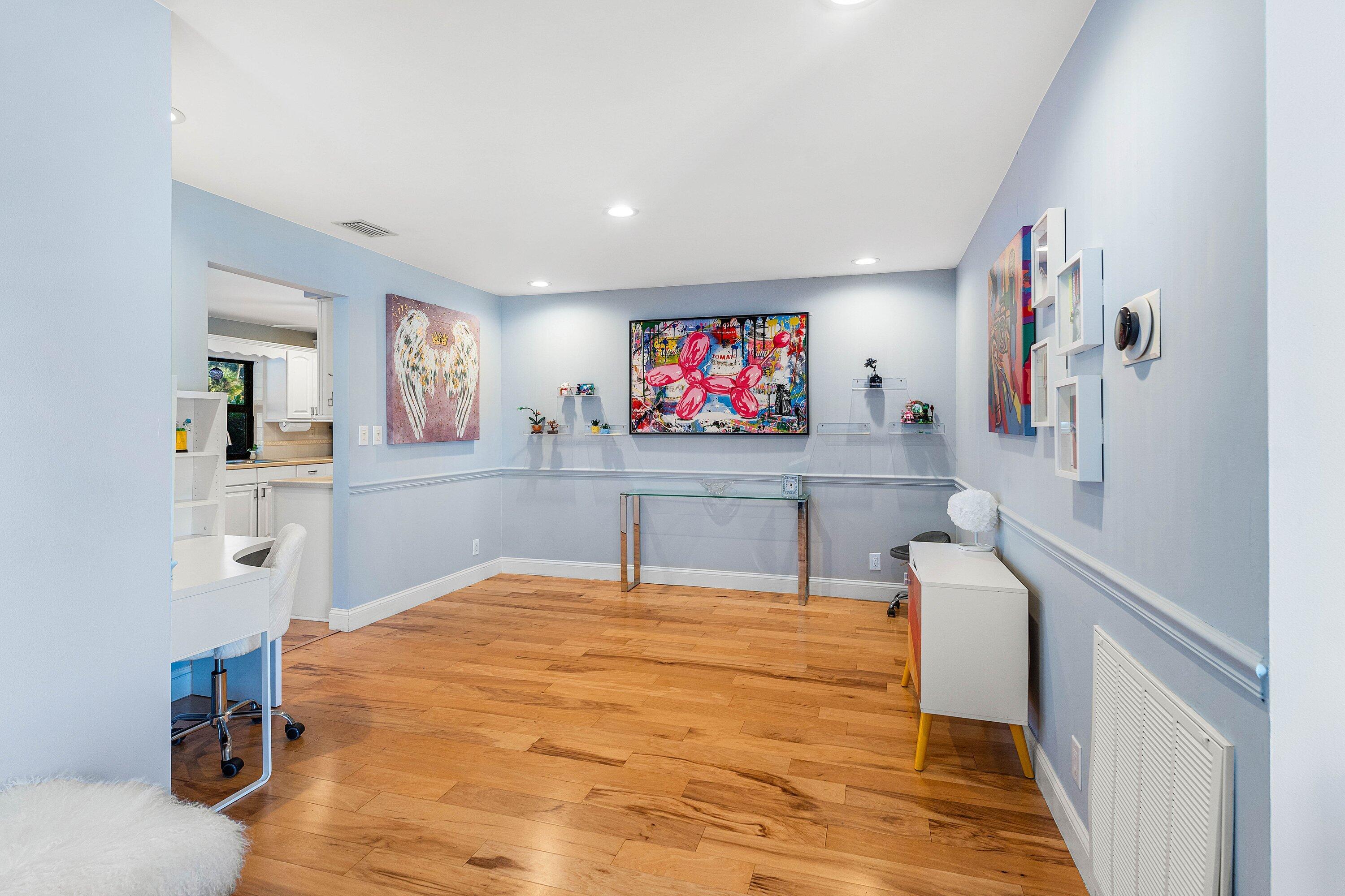 10174 Crosswind Road Boca Raton, FL 33498 - Photo 9 of 45 a room with furniture and a flat screen tv