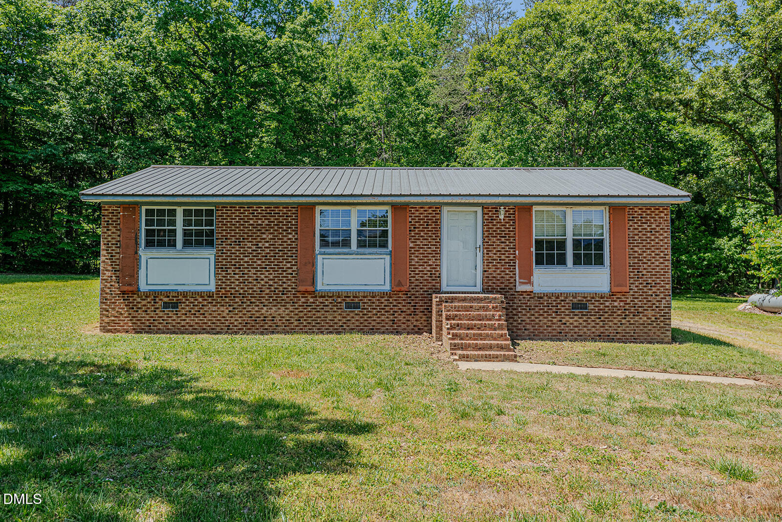 1302 Blacksmith Road Efland, NC 27243 - Photo 29 of 46 front view of a house with a yard