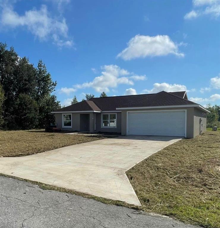 0 Southwest 57th Terrace Road Ocala, FL 34473 - Photo 1 of 1 a front view of a house with a yard