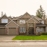 a view of a yard in front of a house