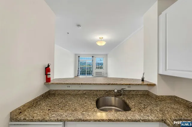 a kitchen with a sink and cabinets