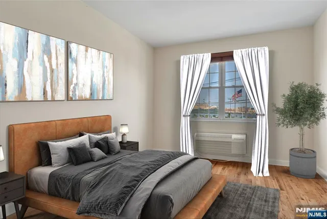 a bedroom with a bed and a window