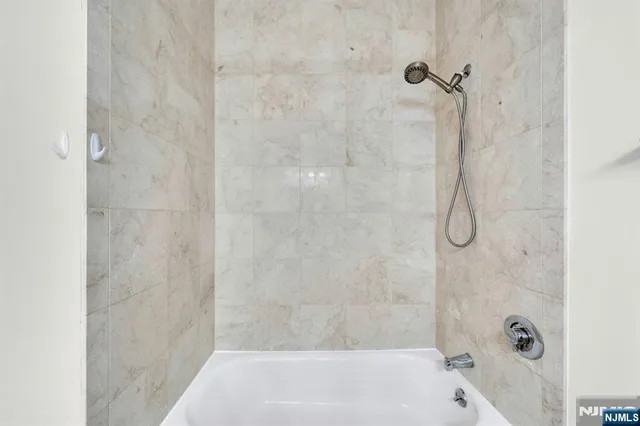 a bathroom with a bath tub