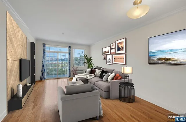 a living room with furniture a large window and a flat screen tv