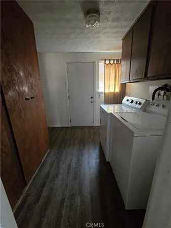 a stove top oven sitting inside of a kitchen