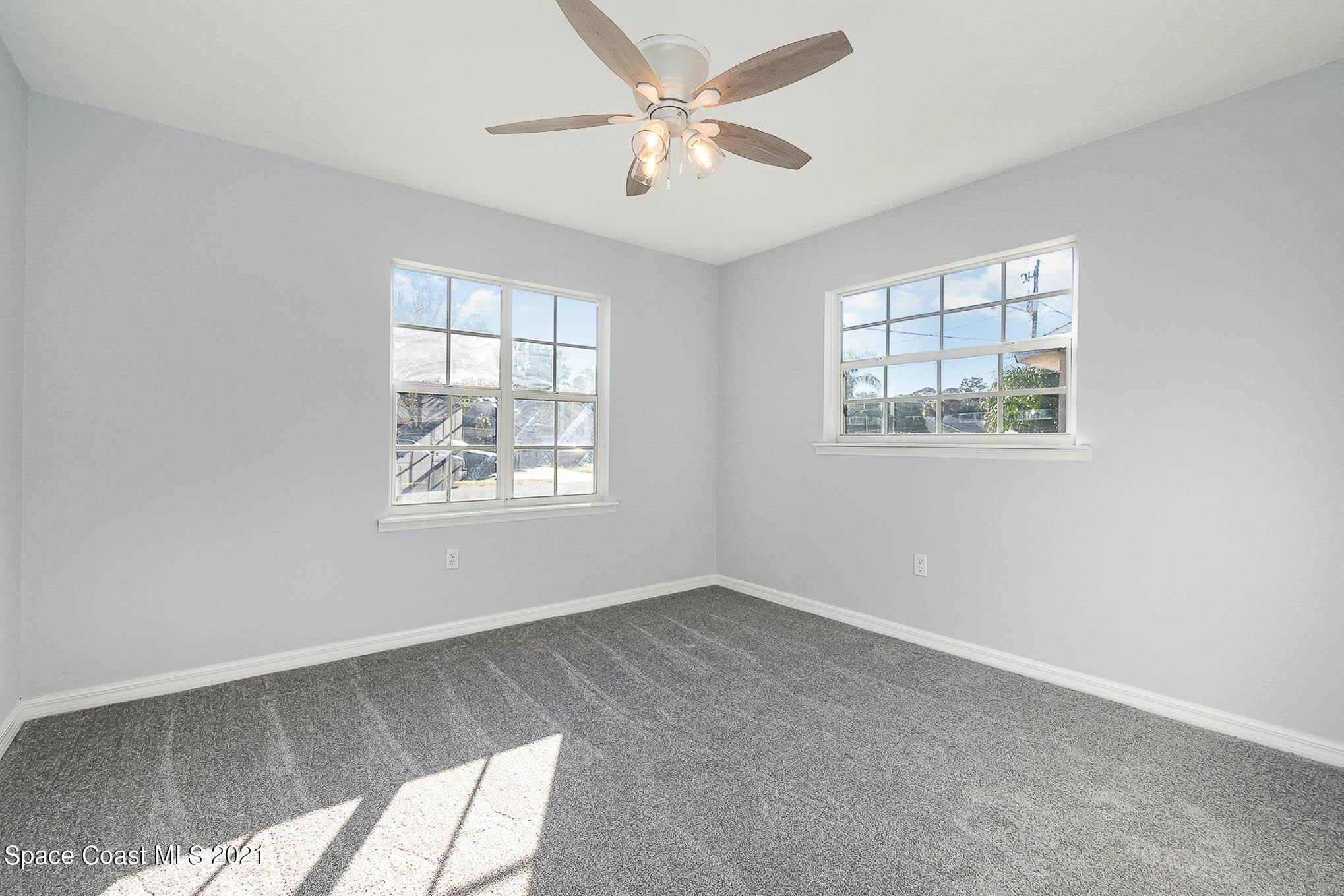 6430 Irving Road Cocoa, FL 32927 - Photo 14 of 22 a view of an empty room with a window