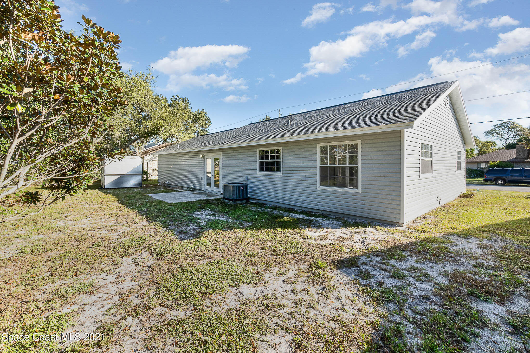 6430 Irving Road Cocoa, FL 32927 - Photo 22 of 22 a view of a house with a yard
