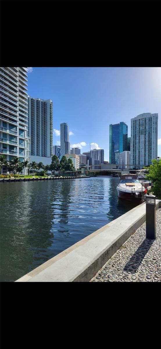 690 Southwest 1st Court, Unit 1722 Miami, FL 33130 - Photo 25 of 35 a view of a lake with building in front of it