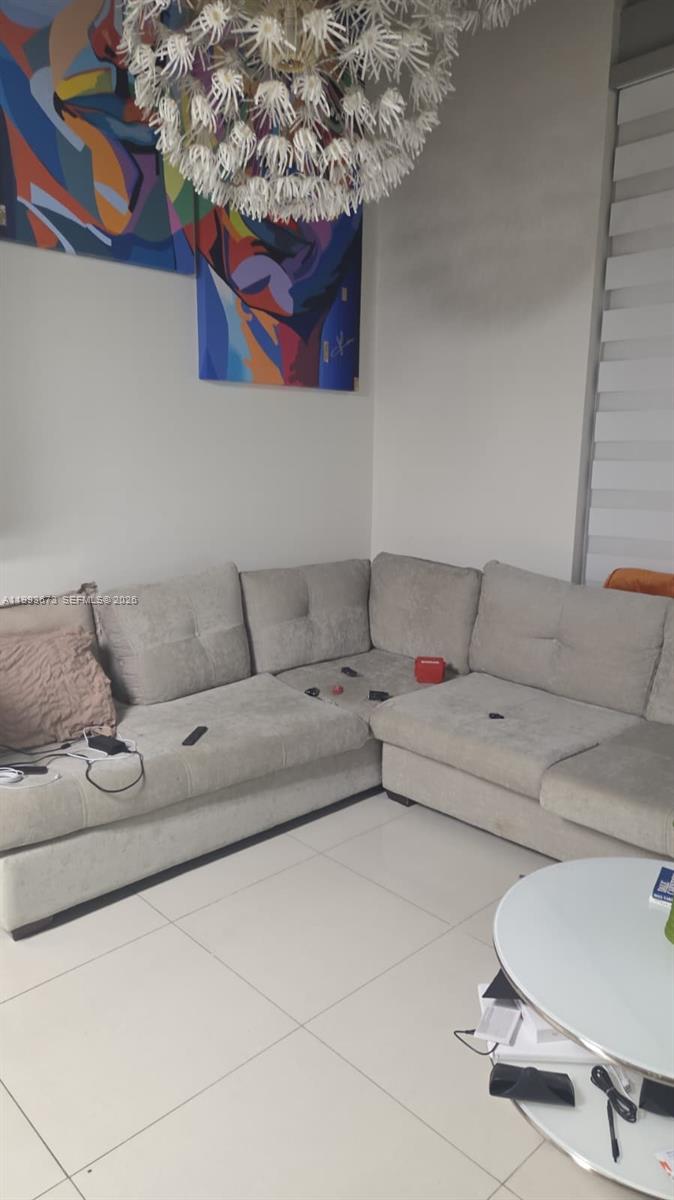 690 Southwest 1st Court, Unit 1722 Miami, FL 33130 - Photo 6 of 35 a living room with furniture and a couch