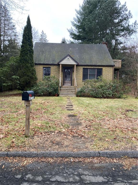 a front view of a house with yard and garage