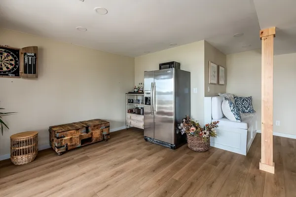 a view of a livingroom with furniture and a wooden floor