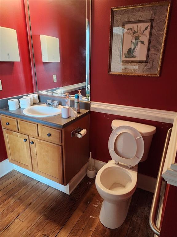 6958 Main Street Lithonia, GA 30058 - Photo 42 of 55 a bathroom with a toilet sink and mirror