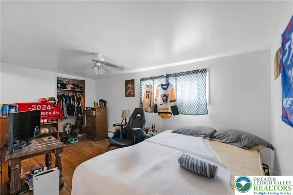 a bedroom with bed and a window