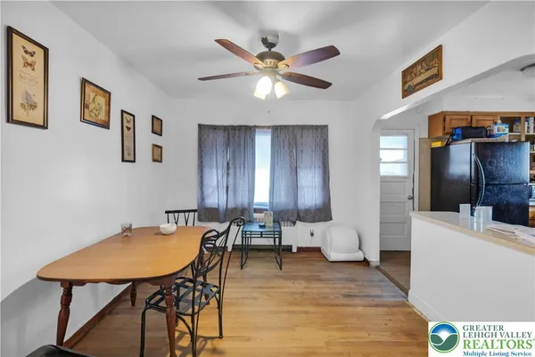 a view of a dining room with furniture and wooden floor